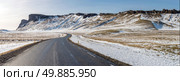 Winter Mountain range road in a sunny day at Vik, Southern of Iceland. Стоковое фото, агентство Ingram Publishing / Фотобанк Лори
