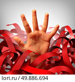 Bureaucratic red tape problem as a human hand tangled in bureaucracy and regulations as a business concept and symbol of government gridlock or corporate regulatory confusion. Стоковое фото, агентство Ingram Publishing / Фотобанк Лори