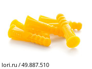 Yellow plastic dowels isolated on white background. Стоковое фото, агентство Ingram Publishing / Фотобанк Лори