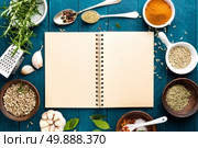 culinary background and recipe book with various spices on wooden table. Стоковое фото, агентство Ingram Publishing / Фотобанк Лори
