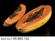 Fresh and tasty papaya on black background. Стоковое фото, агентство Ingram Publishing / Фотобанк Лори