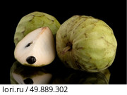 Custard apple, also known as Bullocks or Bulls Heart.On black with reflection. Стоковое фото, агентство Ingram Publishing / Фотобанк Лори