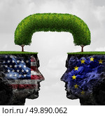 American European partnership and international trade agreement financial concept as two seperate mountain cliffs united together by a connected tree as a global cooperation symbol in a 3D illustration style. Стоковое фото, агентство Ingram Publishing / Фотобанк Лори