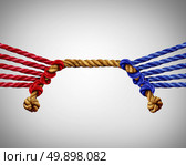 Tug of war business competition as a group of red versus blue ropes competing in opposite sides as a teamwork clash metaphor for team rivalry or corporate rivals. Стоковое фото, агентство Ingram Publishing / Фотобанк Лори