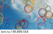 Bubbles fly in blue sky with clouds. Стоковая анимация, аниматор Михаил Коханчиков / Фотобанк Лори