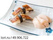 Unagi Sushi and fresh scallop hotate sashimi. Стоковое фото, агентство Ingram Publishing / Фотобанк Лори