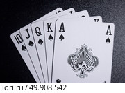 royal flush poker card on dark black background. Стоковое фото, агентство Ingram Publishing / Фотобанк Лори