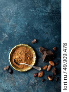 Cocoa powder, beans and dark chocolate pieces crushed, culinary background, top view. Стоковое фото, агентство Ingram Publishing / Фотобанк Лори