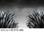 Bomb war threat as a stock pile of dangerous military ballistic missiles and nuclear or atomic rockets facing off and competing in a threatening manner as a geopolitical world war three threat as a 3D illustration. Стоковое фото, агентство Ingram Publishing / Фотобанк Лори