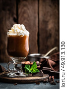 Iced cocoa drink with whipped cream, cold chocolate beverage, coffee frappe on dark background. Стоковое фото, агентство Ingram Publishing / Фотобанк Лори