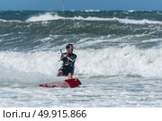 Kiteboarder enjoy surfing on a sunny day. Стоковое фото, агентство Ingram Publishing / Фотобанк Лори