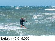 Kiteboarder enjoy surfing on a sunny day. Стоковое фото, агентство Ingram Publishing / Фотобанк Лори