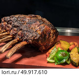 Carving of Wagyu beef roast Prime rib. Стоковое фото, агентство Ingram Publishing / Фотобанк Лори