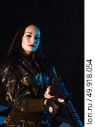 Portrait of attractive woman in military style. Стоковое фото, агентство Ingram Publishing / Фотобанк Лори