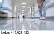 Cleaning a hospital corridor during the day shift for hygiene maintenance. Стоковое AI-изображение, AI-художник Katsiaryna Repich / Фотобанк Лори