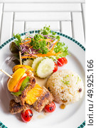 grilled beef skewer with fried rice. Стоковое фото, агентство Ingram Publishing / Фотобанк Лори