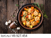 Meatballs stewed with vegetables on wooden table, top view. Стоковое фото, агентство Ingram Publishing / Фотобанк Лори