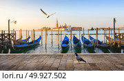 Gondolas and San Giorgio Maggiore island in Venice, Italy. Стоковое фото, агентство Ingram Publishing / Фотобанк Лори