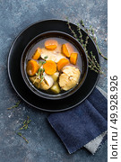 Delicious fresh fish soup with hake in bowl on table. Top view. Стоковое фото, агентство Ingram Publishing / Фотобанк Лори
