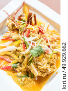 Lobster stir fried with spice curry. Стоковое фото, агентство Ingram Publishing / Фотобанк Лори