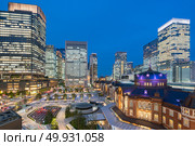 Landscape of Tokyo Station at dusk with building skyline. Стоковое фото, агентство Ingram Publishing / Фотобанк Лори