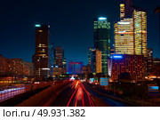 Road to skyscrapers of parisian district la Defense at night, France. Стоковое фото, агентство Ingram Publishing / Фотобанк Лори