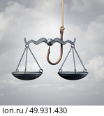Law trap or entrapment and trapped by the legal system concept as a hook with a justice scale as bait as a 3D illustration. Стоковое фото, агентство Ingram Publishing / Фотобанк Лори