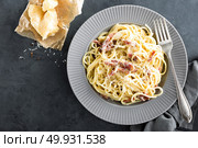 Carbonara pasta, spaghetti with pancetta, egg, hard parmesan cheese and cream sauce. Traditional italian cuisine. Pasta alla carbonara. Стоковое фото, агентство Ingram Publishing / Фотобанк Лори