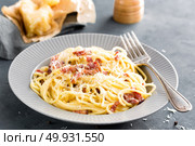 Carbonara pasta, spaghetti with pancetta, egg, hard parmesan cheese and cream sauce. Traditional italian cuisine. Pasta alla carbonara. Стоковое фото, агентство Ingram Publishing / Фотобанк Лори
