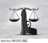 Gun law and weapon legislation concept as a handgun shaped as a justice scale as a legal rights idea as a 3D illustration. Стоковое фото, агентство Ingram Publishing / Фотобанк Лори