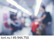 Abstract Blur image of people inside Mass Rapid Transit (MRT) subway train, Singapore. Стоковое фото, агентство Ingram Publishing / Фотобанк Лори