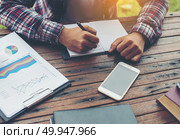 Hipster Businessman Working writing Determine Workspace Lifestyl. Hipster Businessman Working writing Determine Workspace Lifestyle Concept. Стоковое фото, агентство Ingram Publishing / Фотобанк Лори