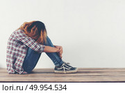 sad woman hug her knee and cry so lonely. Стоковое фото, агентство Ingram Publishing / Фотобанк Лори