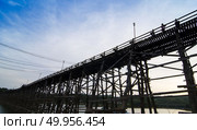 The wooden bridge is the second longest in the world. at Sangklaburi in Kanchanaburi, Thailand. Стоковое фото, агентство Ingram Publishing / Фотобанк Лори