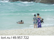 Phuket, THAILAND - JANUARY 4, 2017. A tourist wearing a bikini swim in the sea in Phuket. Редакционное фото, агентство Ingram Publishing / Фотобанк Лори