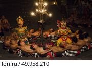 BALI, INDONESIA - JUNE 15: Presentation of traditional balinese Women Kecak Fire Dance on JUNE 15, 2015 on Bali. Kecak (also known as Ramayana Monkey Chant) is very popular cultural show on Bali. Редакционное фото, агентство Ingram Publishing / Фотобанк Лори