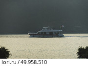 Nantou, Taiwan - November 02, 2016 : Tourist boats docking in peachful morning at Shuishe Pier, Sun Moon Lake, Taiwan. Редакционное фото, агентство Ingram Publishing / Фотобанк Лори