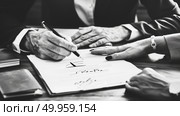 Two individuals at a table, one signing a document, with hands and paperwork in focus. Стоковое AI-изображение, AI-художник Данила Большаков / Фотобанк Лори