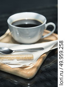 Coffee cup and saucer on old wooden table. Стоковое фото, агентство Ingram Publishing / Фотобанк Лори