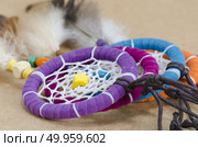 colorful dreamcatcher on brown vintage background. Стоковое фото, агентство Ingram Publishing / Фотобанк Лори