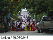 SANGKLABURI - November 19, 2016 : Thai people donated food to the monks in Sankaburi,Thailand on November 19, 2016. Sanklaburi is popular town for the tourism in Thailand. Редакционное фото, агентство Ingram Publishing / Фотобанк Лори