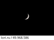 Луна в фазе первой четверти на фоне черного неба. Вид с северного полушария Земли. Стоковое фото, фотограф Алексей Винников / Фотобанк Лори