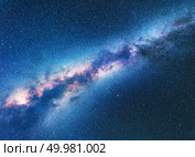 Milky Way. Space background with starry sky. Fantastic night landscape with bright milky way, blue sky full of stars. Shiny stars. Beautiful scene with universe. Astrophotography. Galaxy. Стоковое фото, агентство Ingram Publishing / Фотобанк Лори