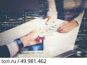 Double Exposure, Hand receiving money, US dollars. Стоковое фото, агентство Ingram Publishing / Фотобанк Лори