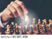 Businessman play with chess game. concept of business strategy and tactic. Стоковое фото, агентство Ingram Publishing / Фотобанк Лори