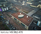 Kiev, Ukraine.- January 11,2018: Aerial view of the city of Kiev view of the railway station, trains and cars parked near the train station. Aerial view of the city of Kiev. Редакционное фото, агентство Ingram Publishing / Фотобанк Лори