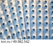 KIEV, UKRAINE - July 19, 2018. Aerial view from drone of the stadium cover structure - NSC Olimpiysky. Elements of the stadium construction. Construction of the stadium roof. Top view from drone.. KYIV, UKRAINE - July 19, 2018. National Sports Complex Olympic NSC Olimpiysky. Elements of the stadium construction of the stadium roof. Редакционное фото, агентство Ingram Publishing / Фотобанк Лори