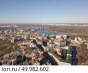 Kiev, Ukraine - April 7, 2018: Trukhanov Island, the Dnieper River and the hem district with the Vladimir Church and St. Andrew’s Church on a blue sky background on a sunny day. Drone photography. Kiev, Ukraine - April 7, 2018: Landscape view of the old district of Podol with the Vladimir Church and St. Andrew’s Church against the blue sky. Редакционное фото, агентство Ingram Publishing / Фотобанк Лори