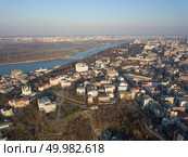 Panoramic view of the city of Kiev and the Dnieper River, Podol district with the St. Sophia Church, the Museum of History of Kiev and the old staircase. Kiev, Ukraine. Drone photo. Aerial view of Saint Andrew church. The old town of Kiev, the Podile district. Стоковое фото, агентство Ingram Publishing / Фотобанк Лори