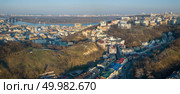 Panoramic aerial view from the drone, bird’s eye view to the Vozdvizhenka, Podolsky bridge, St. Andrew’s Church, National Museum of Ukrainian History, Andreevsky descent, Truhanov Island.. A bird’s eye view, aerial panoramic view from drone to the Podol district, oldest historical center of Kiev, the Dnieper River and the left bank of Dnieper in the city of Kiev, Ukraine. Стоковое фото, агентство Ingram Publishing / Фотобанк Лори